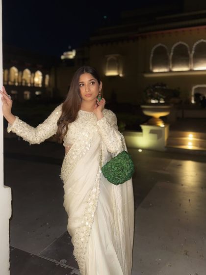 Posing in this beautiful sequined saree. The full-sleeve blouse adds a modern touch to the traditional silhouette, making it a great option for a winter wedding.