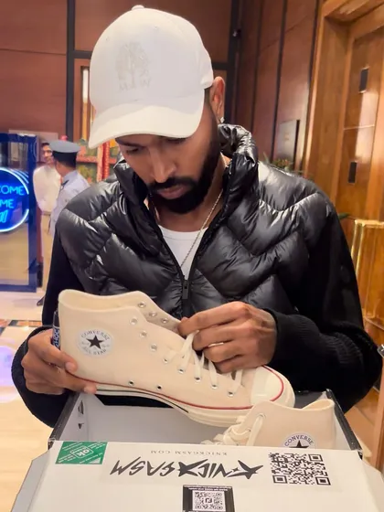 We had the opportunity to present Indian cricketer Hardik Pandya with his own custom Converse sneakers. He's seen here inspecting the final product, a moment that captures the personal and exclusive nature of our work.