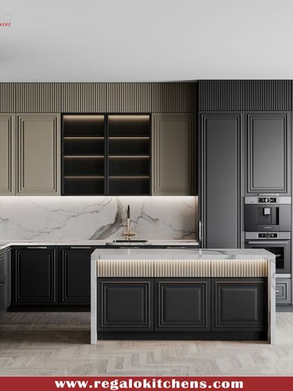 A sophisticated two-tone kitchen combining classic black paneled cabinets with beige accents. The central island includes a breakfast bar and is illuminated by under-cabinet lighting, creating a warm and functional focal point.