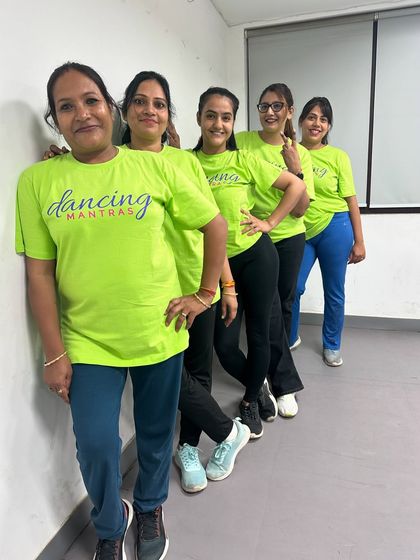 The "Sassy Shufflers" ladies batch posing together. Their smiles show the joy and friendship they find in our dance classes.