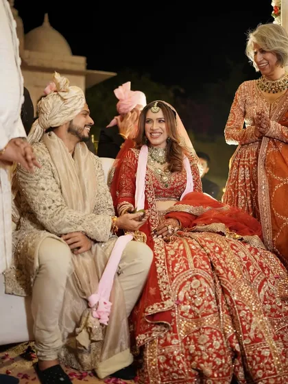 A candid moment of pure happiness. Our soft glam makeup ensures the bride looks radiant and feels comfortable throughout her wedding ceremony.