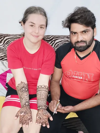 I am happy to serve clients from all over the world for their weddings in Mumbai. Here is a happy international client showing her full-arm traditional Indian mehandi.