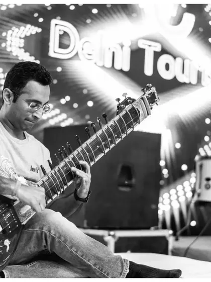 Performing with the legendary Indian rock band Parikrama for Delhi Tourism. This black and white shot captures the energy of our Sitar-Rock fusion.