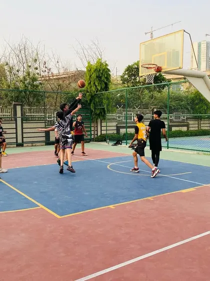 A player goes up for a shot, perfectly timed to avoid the block. We work on shot selection and timing.