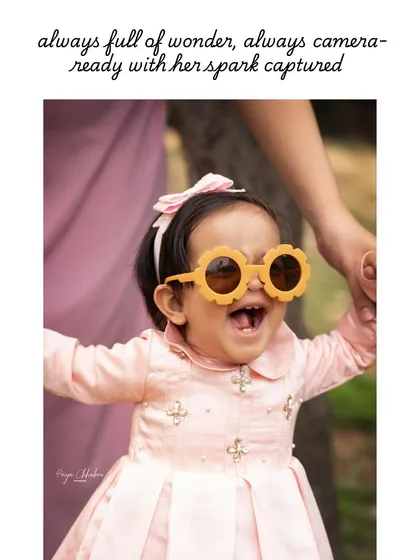 Always full of wonder and ready for the camera! A first birthday shoot is all about capturing their budding personality, and these fun, flower-shaped sunglasses brought out the biggest, happiest smile.
