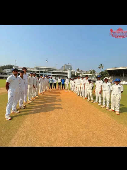 Both teams line up on the pitch at Brabourne Stadium, showcasing sportsmanship and the competitive spirit of the game.