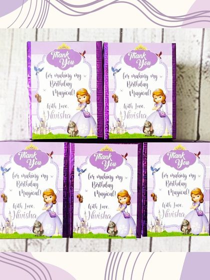 A sweet and simple party favor idea: themed chocolates. These are wrapped with a custom "Sofia the First" design for a magical touch.