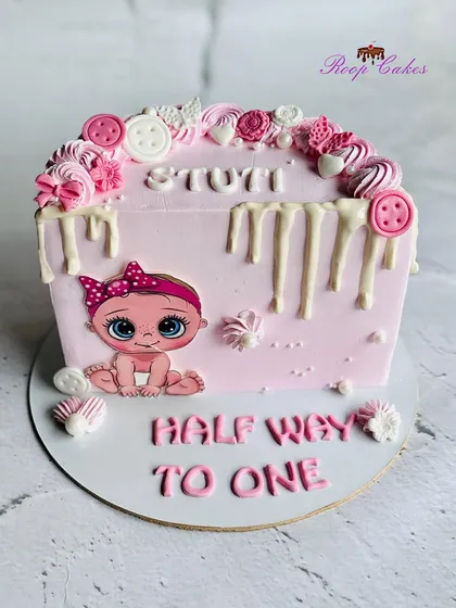 The sweetest 'Halfway to One' celebration for a baby girl. This pink drip cake is a perfect way to mark a 6-month milestone.
