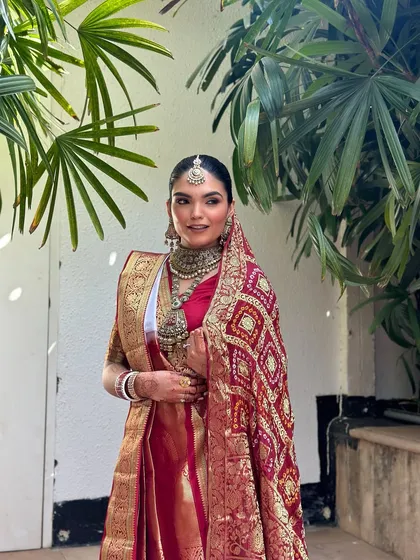 The joy of a classic bride. This look is all about timeless elegance, with clean skin, beautifully defined eyes, and a makeup style that complements traditional attire perfectly, captured in natural light.