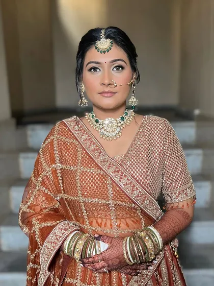 A portrait of the bride looking confident and serene. The makeup enhances her features without overpowering them, staying true to my philosophy of enhancing natural beauty.