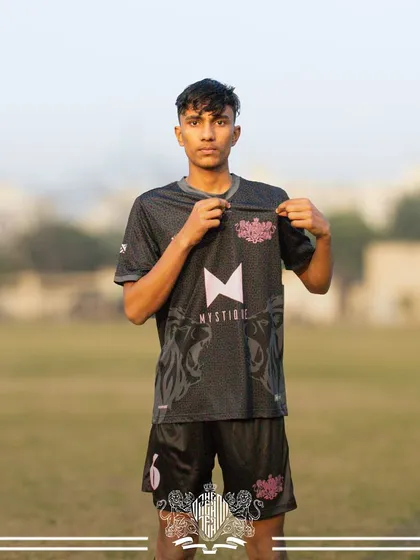 U17 Lion, pointing to his team's crest.
