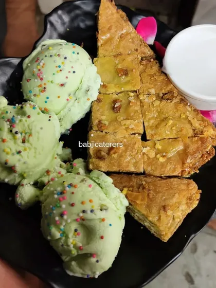A delightful combination of Pistachio Baklava and Pista Vanilla ice cream. The flaky, nutty pastry pairs perfectly with the cool, creamy ice cream.