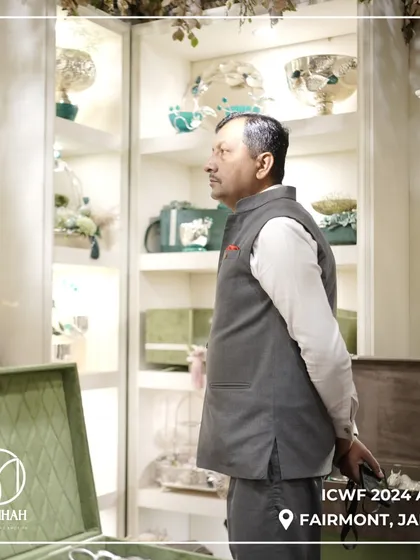 A guest taking in the full display at our ICWF booth. The shelves were curated to show the breadth of our collection, from serveware to decorative bowls.