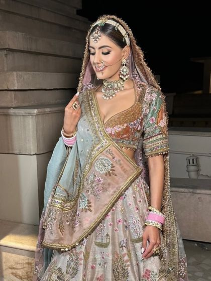 A close-up of the Pichwai lehenga, highlighting the detailed artwork and the bride's radiant expression. This is how you blend tradition with personal style.