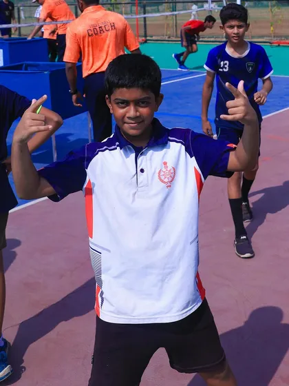 The energy and fun of our volleyball camp are perfectly captured in this player's pose. It is all about having a good time while learning.