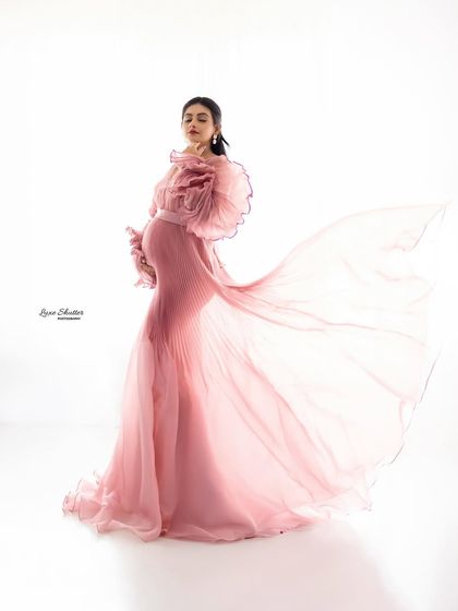 Capturing the gown in motion adds a beautiful, ethereal quality to the photograph. The way the light shines through the sheer fabric creates a truly magical effect.