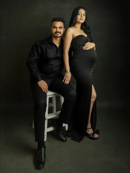 A classic, confident pose for the parents-to-be. Dressed in black, this portrait is sleek, modern, and timeless, a perfect representation of your partnership.