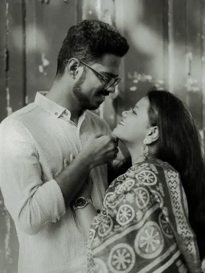 A beautiful black and white portrait of the couple, highlighting their expressions and the emotional connection between them.