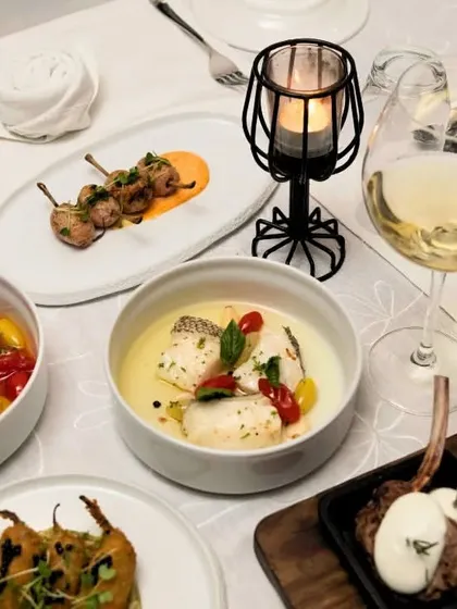 Another view of a beautifully laid out table, featuring a mix of our seafood, meat, and vegetarian dishes.