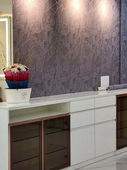 A closer look at the crockery unit with its integrated wash basin. The design is both practical and aesthetically pleasing, with a focus on high-quality materials and finishes.