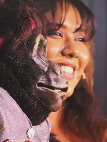 The joy on my face says it all. Sharing a laugh with Nikki and the audience is the best part of my job. This candid shot captures the happiness we bring to the stage.