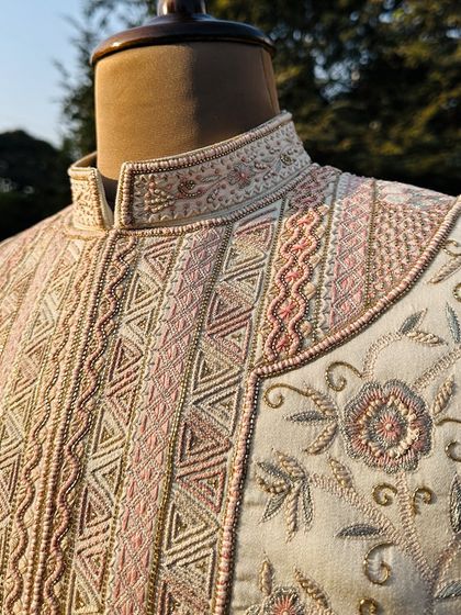A closer look at the detailed hand embroidery on our Koyaliya Sherwani. Each stitch is a testament to the 120+ hours of artistry that go into creating this masterpiece.