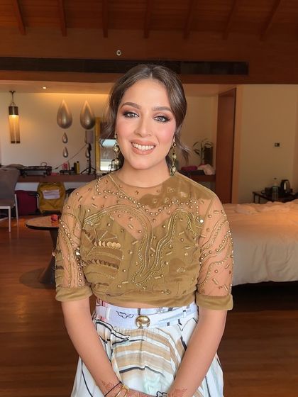 The client looking happy and relaxed, her personalized hairstyle adding a fun element to her look.