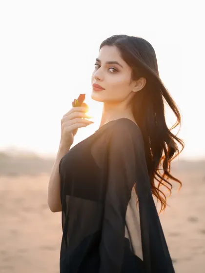 Capturing a serene moment during a golden hour beach photoshoot. The soft, warm light and natural setting are perfect for creating beautiful, atmospheric images for model lookbooks or influencer content.