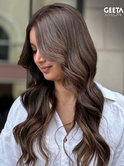 A client with a fresh colour and face-framing layers, a style that is both modern and flattering.