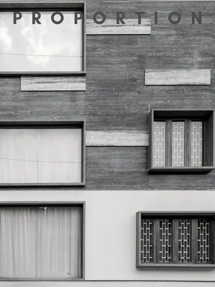 Symmetry and proportion are explored through minimalist geometry and a mix of textured and smooth facade finishes.