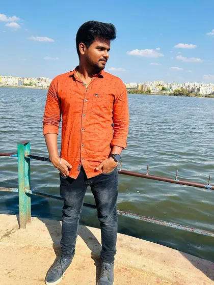 The city skyline is visible across the water, a classic Bengaluru view.
