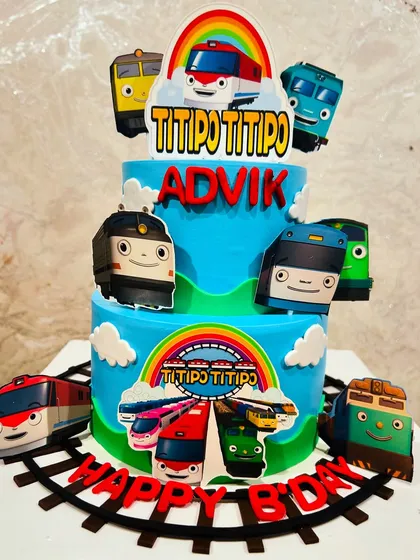 A two-tier Titipo Titipo train cake, bringing the colorful world of the talking trains to life for a birthday celebration.