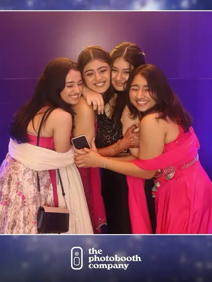 A heartwarming group hug between friends at a cocktail party. These are the candid, emotional moments we love to capture for you to look back on.
