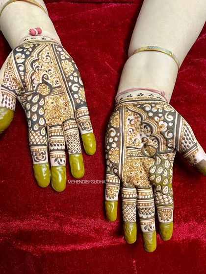 A lovely design featuring a peacock within a paisley shape. The use of dark-filled areas creates a beautiful contrast.