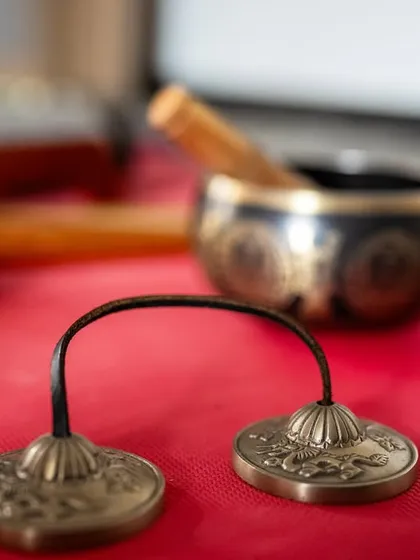 We use a variety of sound healing instruments, like these Tingsha cymbals, to create a rich and immersive soundscape. Their clear, high-pitched tone is used to focus the mind and clear energy.