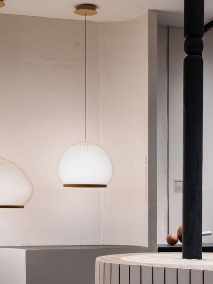 Our 'The Surahi' pendants hanging in the exhibition space. Their soft, diffused light created a calm and welcoming corner within the bustling event.