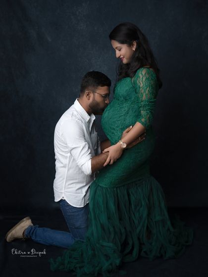 A classic pose of the dad-to-be kissing the baby bump. It's a gesture of pure love and excitement that we love to capture.