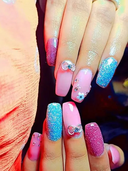 For when you want to go all out! This set has it all: bright blue and magenta glitter, soft pink base nails, and adorable 3D rhinestone bows. I can mix and match elements to create a custom, high-glamour look that is uniquely you.
