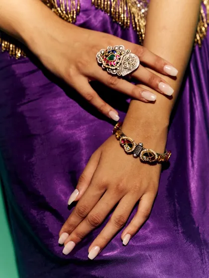 A dedicated accessory shot from the Myntra lookbook. This image highlights the intricate details of the statement ring and bracelet, showing how accessories can complete a festive look.