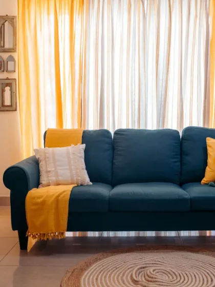 This is what it's all about: creating a space that feels uniquely you. I love how the bold teal sofa comes alive with our sunny yellow throw and layered sheer curtains, turning this living room into a warm, inviting, and vibrant home.