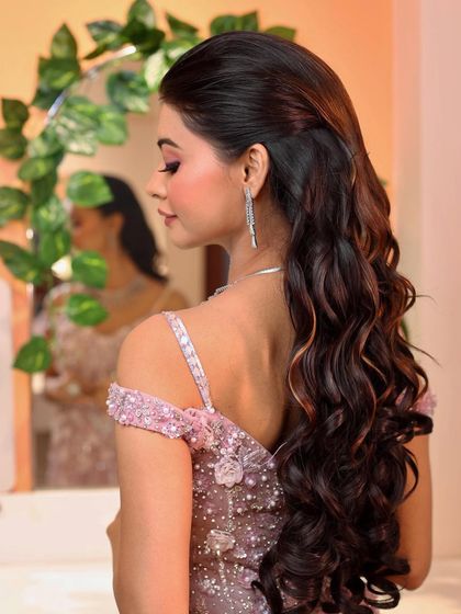 Slaying the beautiful hair. This half-up, half-down hairstyle with voluminous curls is a stunning choice for a reception.