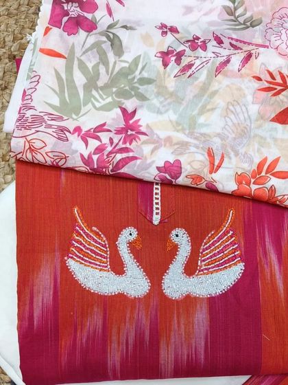 This unique suit piece with embroidered swans is a thoughtful and stylish gift for Mother's Day.