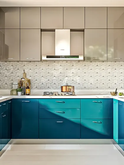 I love using color to create unique and stylish kitchens. This U-shaped layout combines bold, high-gloss teal lower cabinets with neutral grey upper units and a striking geometric backsplash, proving that functional design can also be full of personality.