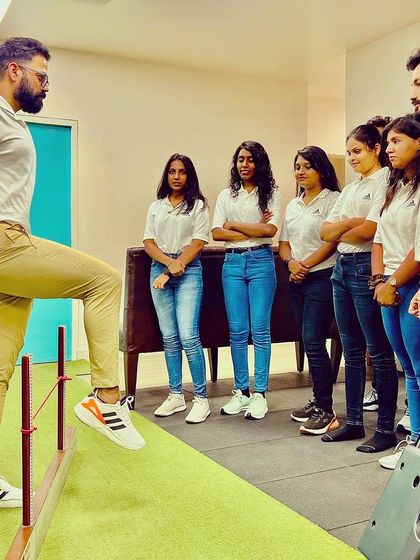 As a leader, I believe in continuous learning. Here, I am demonstrating a movement screening technique to my team, ensuring we all stay updated on the best practices for assessing and improving functional movement.