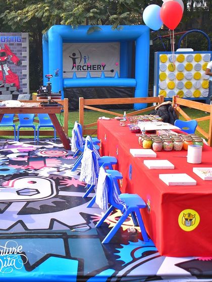 A closer look at the activity tables, with themed flooring and multiple game stations like archery and giant connect-four, ensuring there was something for every child to enjoy.