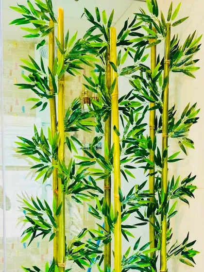 A close-up view of the artificial bamboo stalks. You can see the detail in the nodes and leaves, which makes them nearly indistinguishable from real bamboo plants.