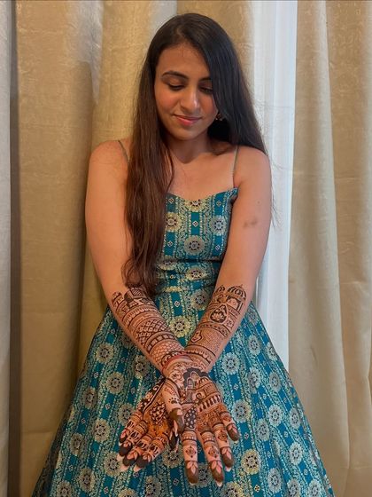 The beautiful bride Shivani, looking elegant and happy with her personalized bridal mehendi.