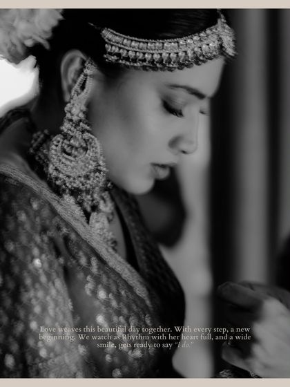 A poignant black and white portrait of Rhythm getting ready. The image captures a quiet, introspective moment before the ceremony, filled with emotion and anticipation.