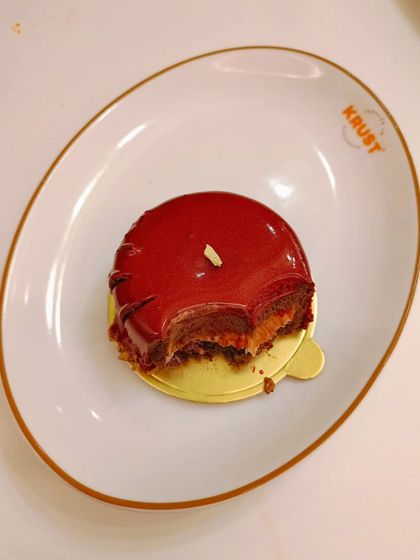 A customer's photo of our Cherry and Chocolate pastry with a bite taken out. I love seeing people enjoy my creations.