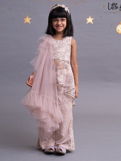 A modern take on ethnic wear, this pant set features a ruffled dupatta and an embroidered top.